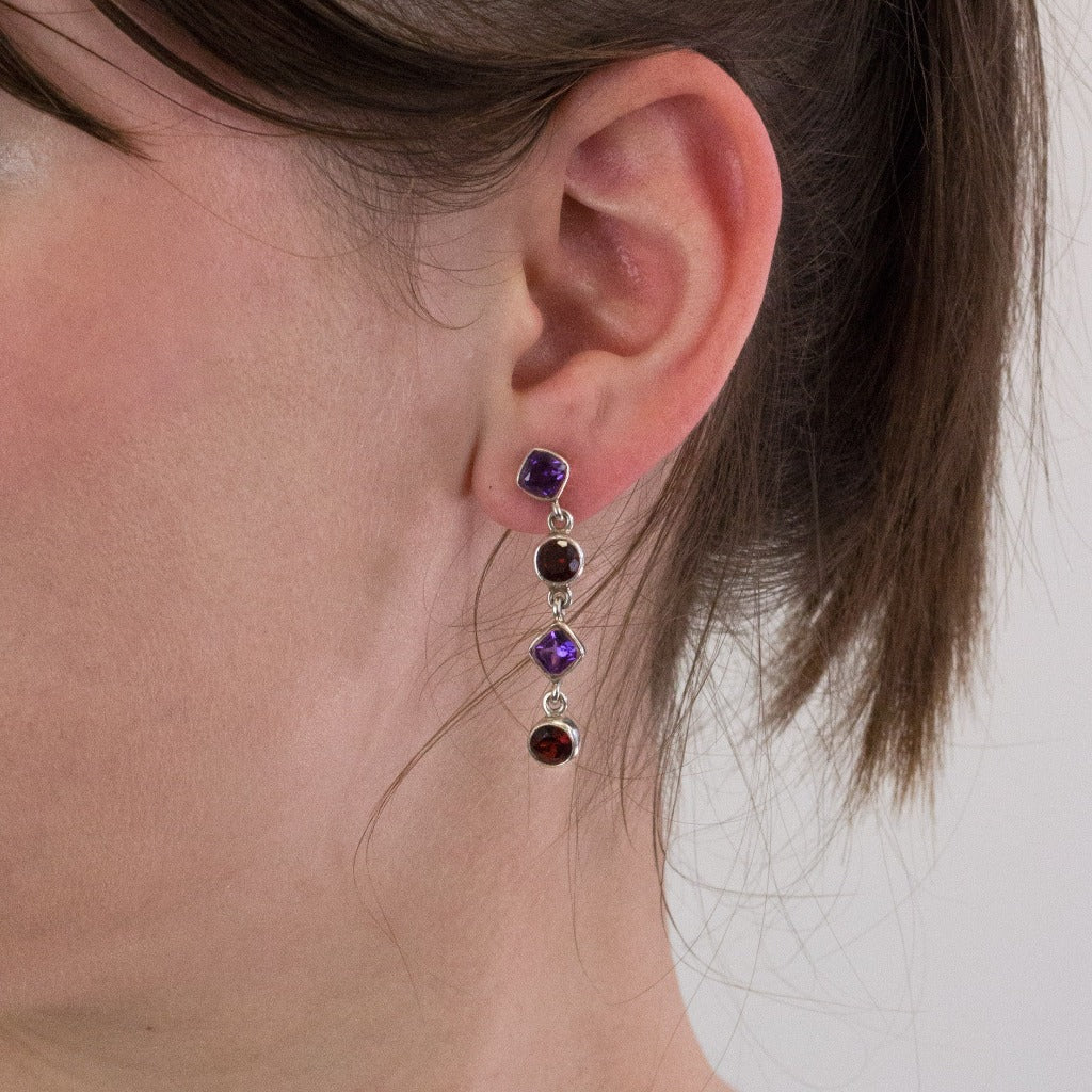 Garnet and Amethyst stud drop earrings on model