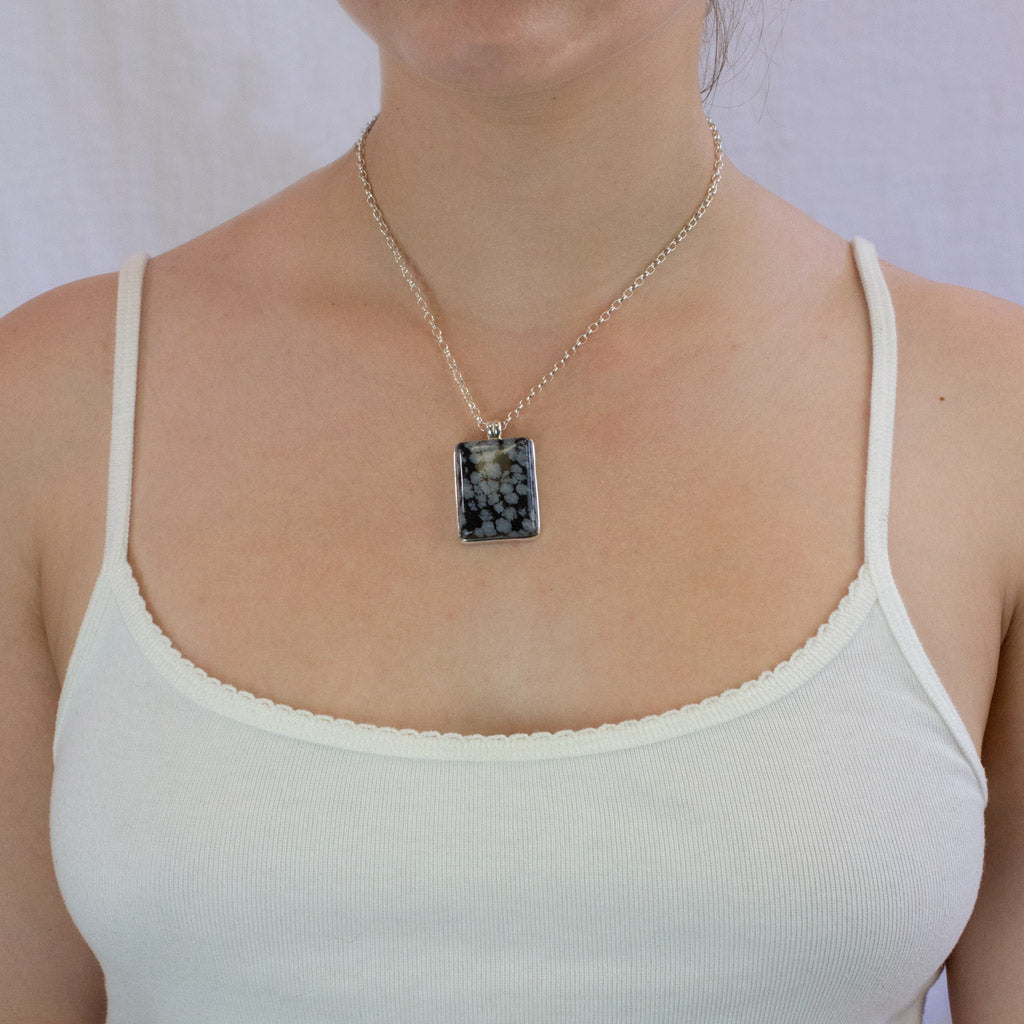 Snowflake necklace on model