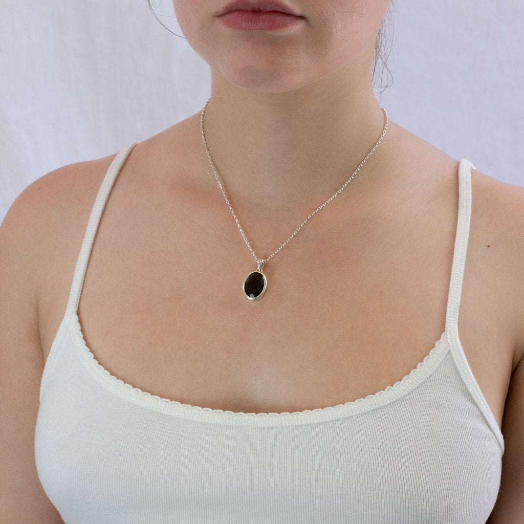 Moldavite necklace on model