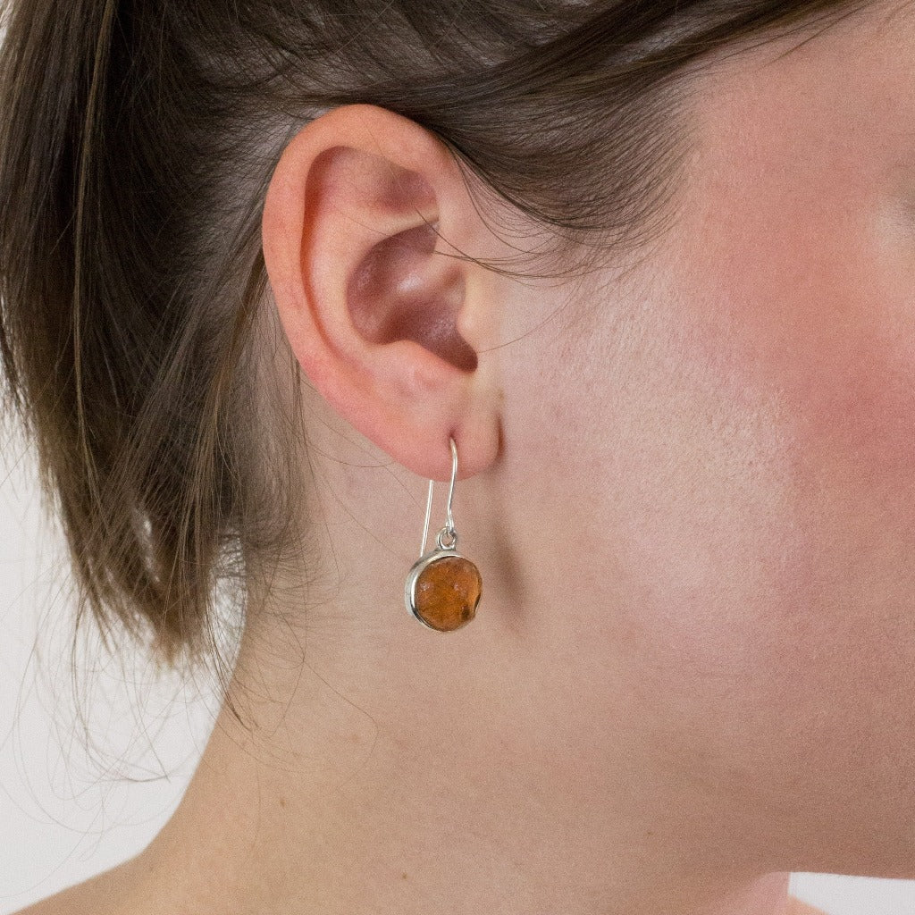 Garnet drop earrings on model
