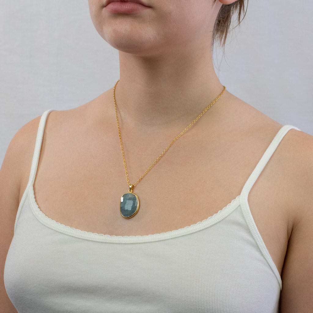 Blue faceted organic Aquamarine Necklace set in 14K Vermeil Gold on model