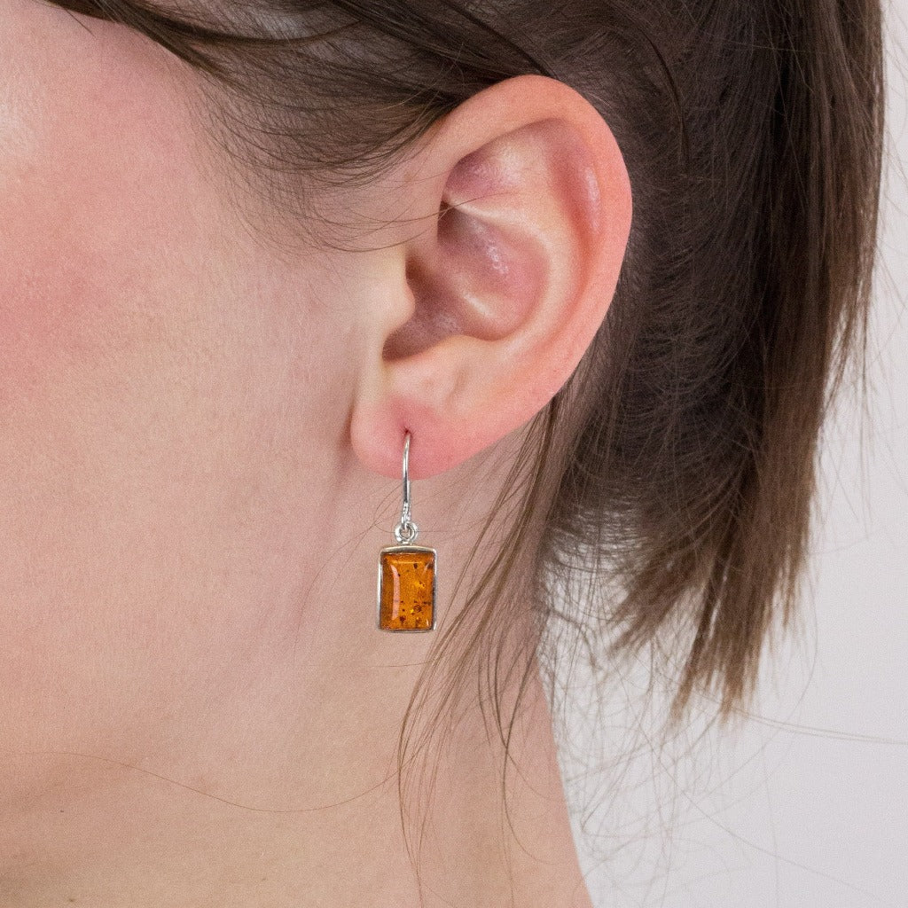 Amber drop earrings on model