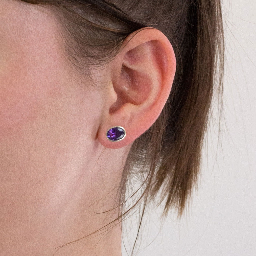 Amethyst stud earrings on model