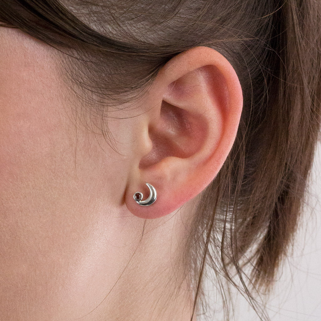 Garnet stud earrings on model