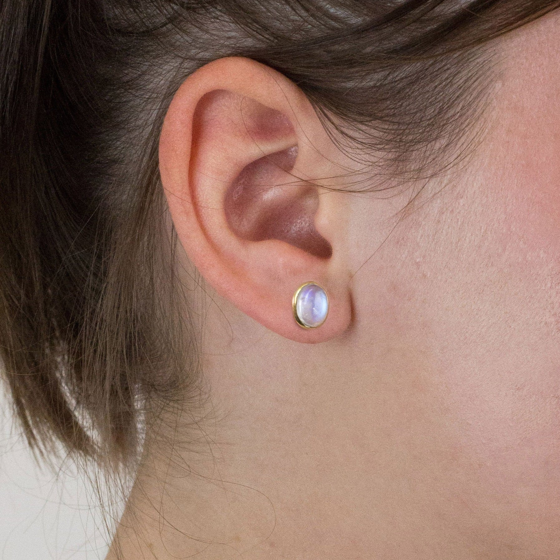 Rainbow Moonstone stud earrings on model