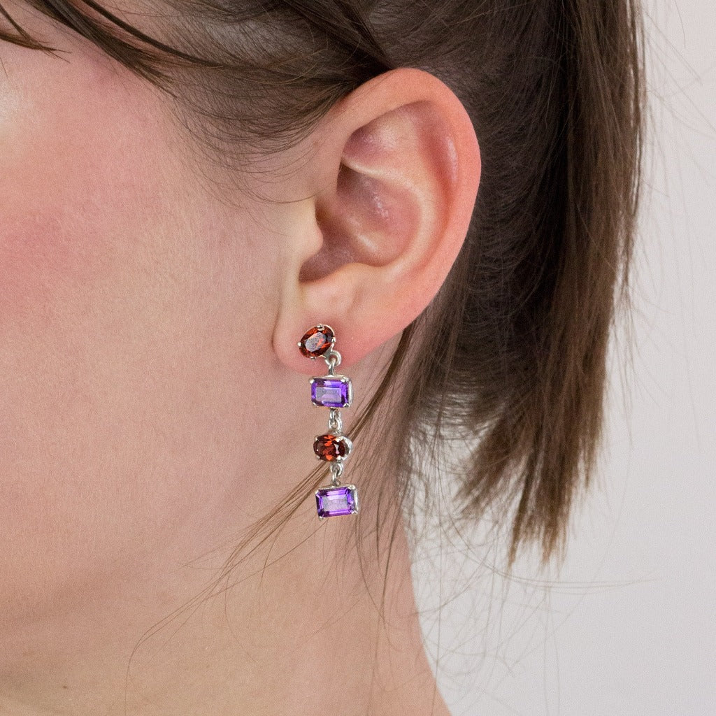 Garnet and Amethyst stud drop earrings on model