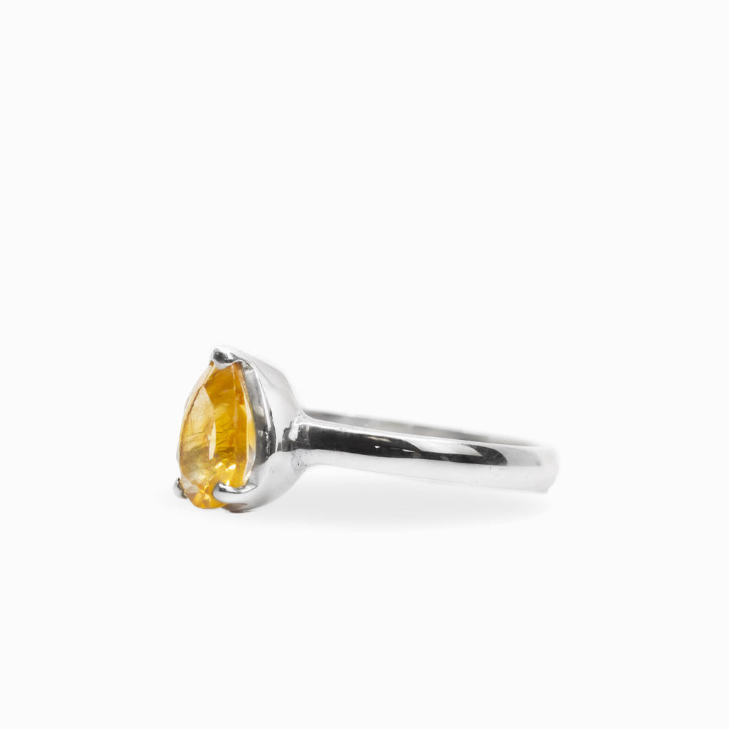 Pear-shaped faceted golden Citrine ring in polished 925 sterling silver with a three-prong setting and slender silver band.