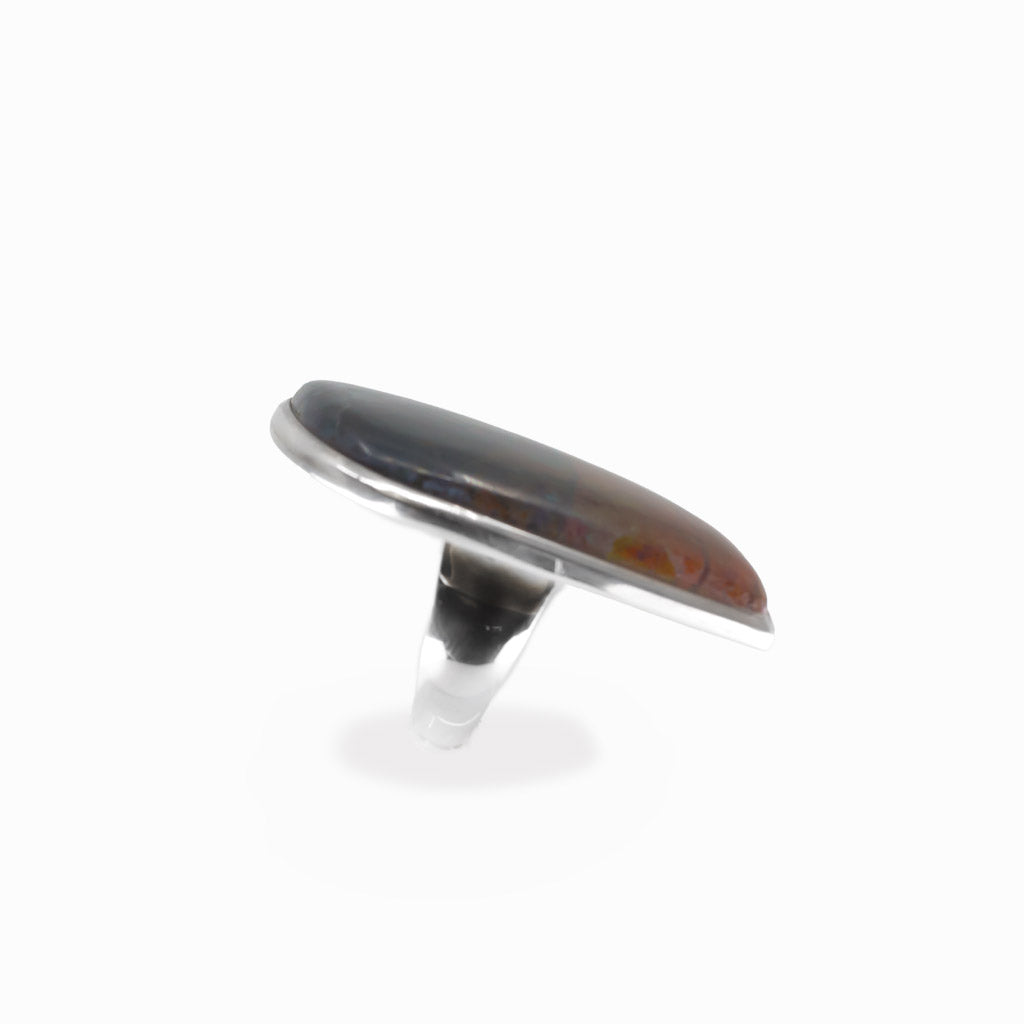 Chrysocolla Cuprite freeform cabochon ring in polished sterling silver with vivid teal blue, turquoise and warm copper mineral patterns.