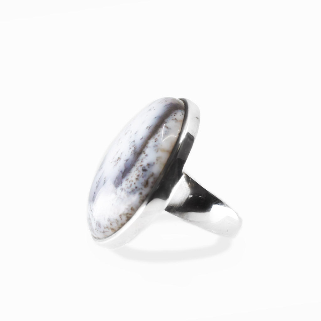 Dendritic Opal round cabochon ring in polished sterling silver with milky white tones and delicate natural branch-like dendritic inclusions.
