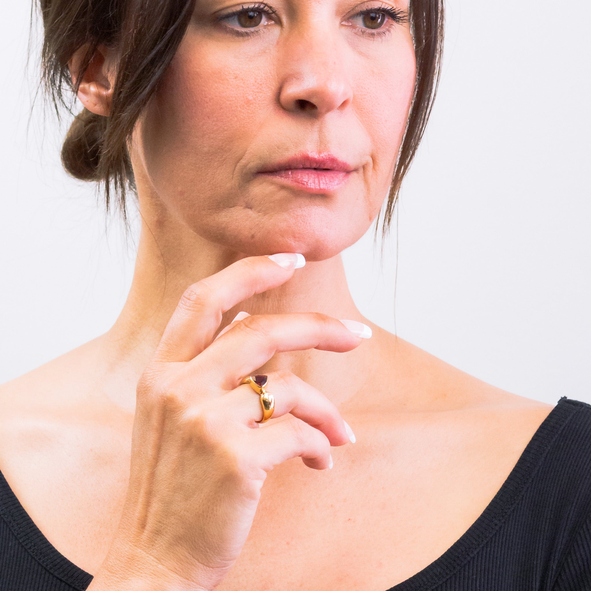 FACETED TRIANGLE GARNET RING ON MODEL