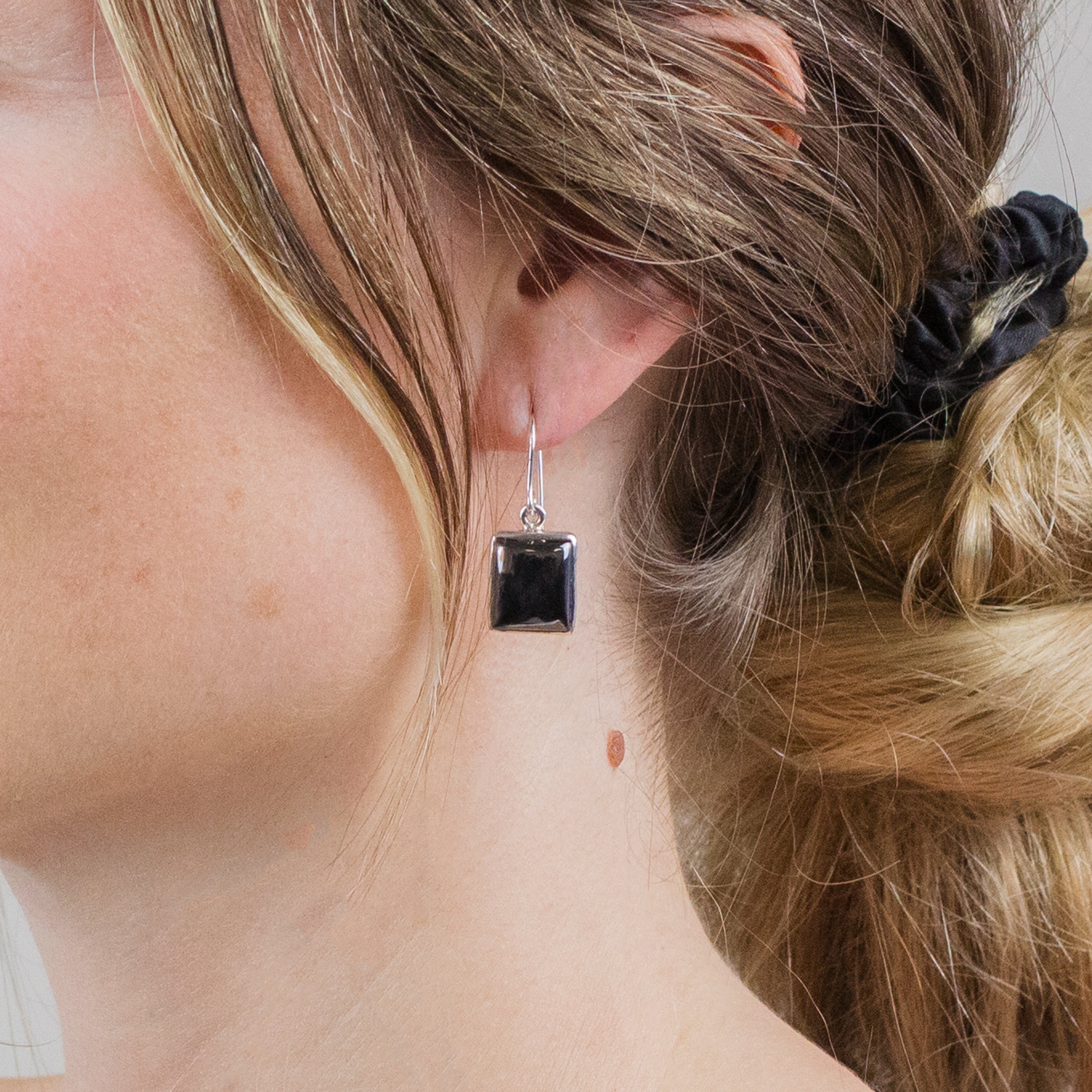 CABOCHON HEMATITE DROP EARRINGS ON MODEL