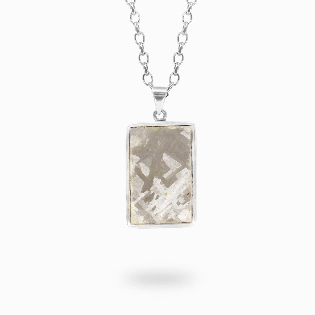 Rectangular Henbury Meteorite pendant set in polished 925 sterling silver.