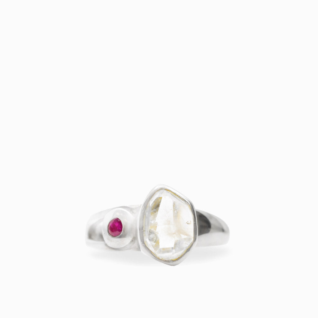 Natural Herkimer Diamond and round Ruby ring in polished 925 sterling silver with an asymmetrical two-stone setting.