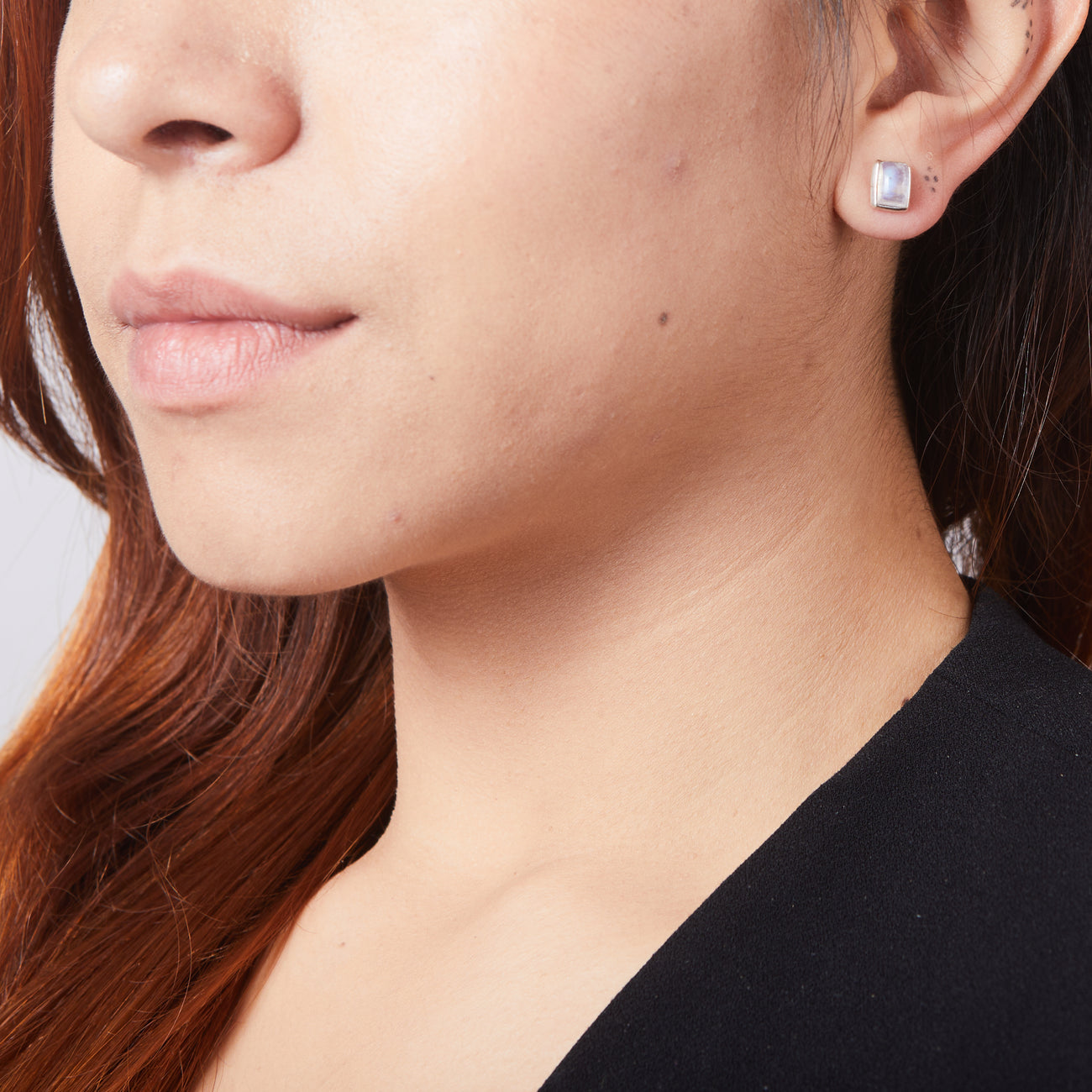 CABOCHON RECTANGLE RAINBOW MOONSTONE STUD EARRINGS STERLING SILVER ON MODEL | MADE IN EARTH