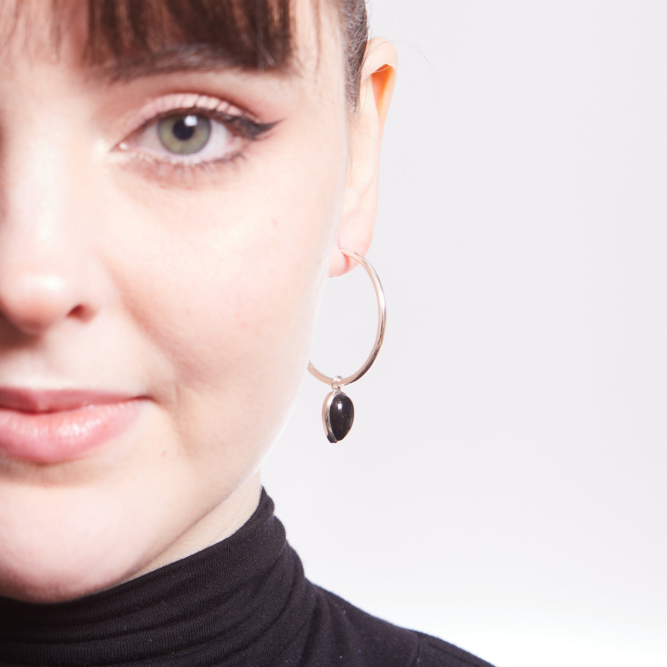 CABOCHON ONYX TEAR HOOP CHARMS ON MODEL | MADE IN EARTH