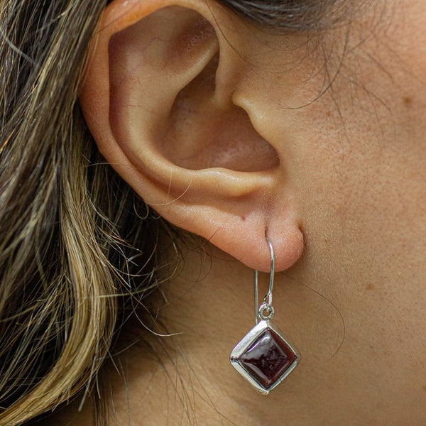 CABOCHON DIAMOND SHAPED GARNET DROP EARRINGS ON MODEL STERLING SILVER | MADE IN EARTH