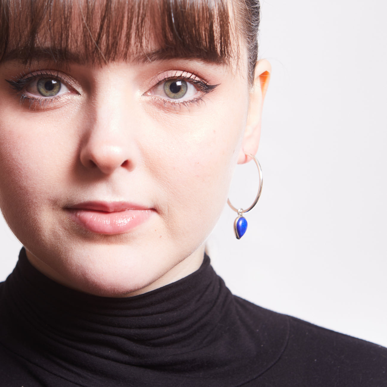 CABOCHON LAPIS LAZULI TEAR HOOP CHARMS ON MODEL | MADE IN EARTH