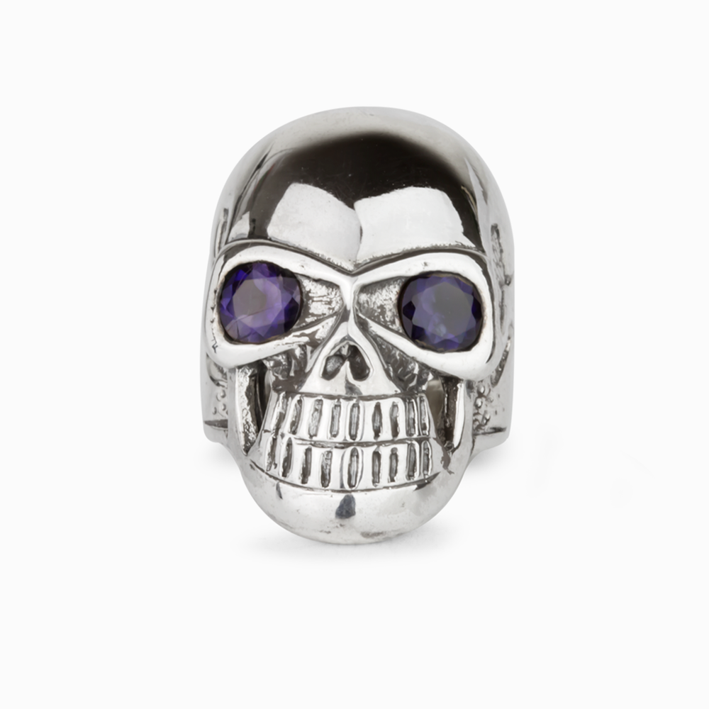 Polished 925 sterling silver skull ring with two round faceted green Peridot gemstone eyes.
