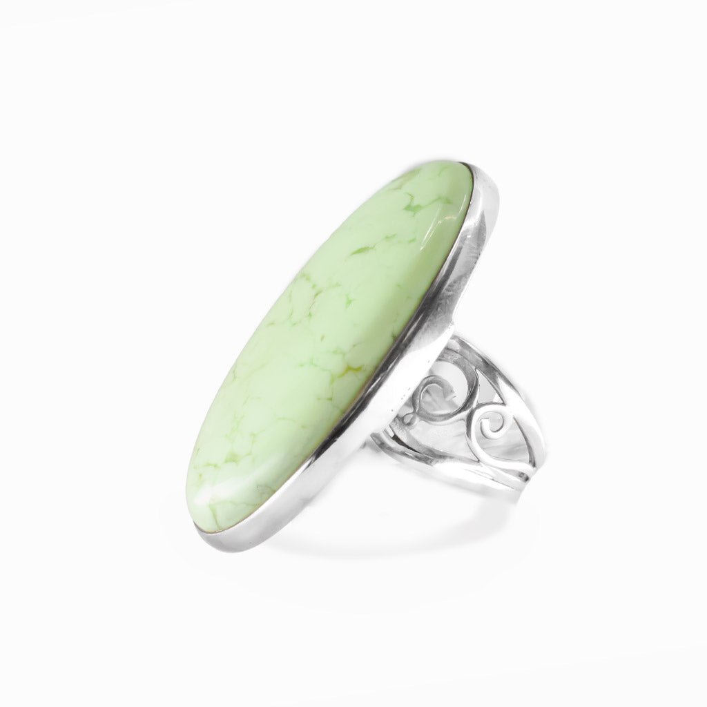 Lemon Chrysoprase oval cabochon ring in polished sterling silver with a luminous pale yellow-green color and delicate natural veining.