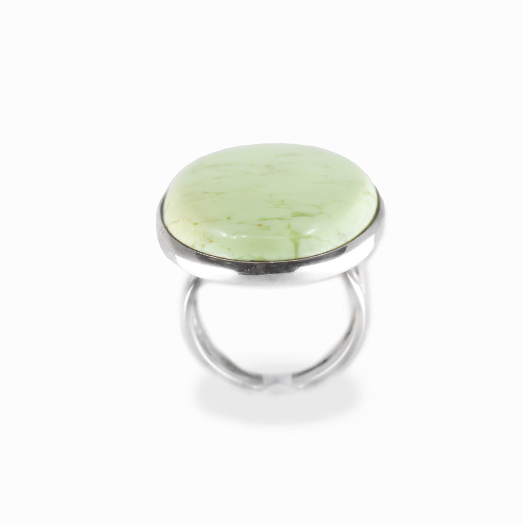 Lemon Chrysoprase oval cabochon ring in polished sterling silver with a luminous pale yellow-green color and delicate natural veining.