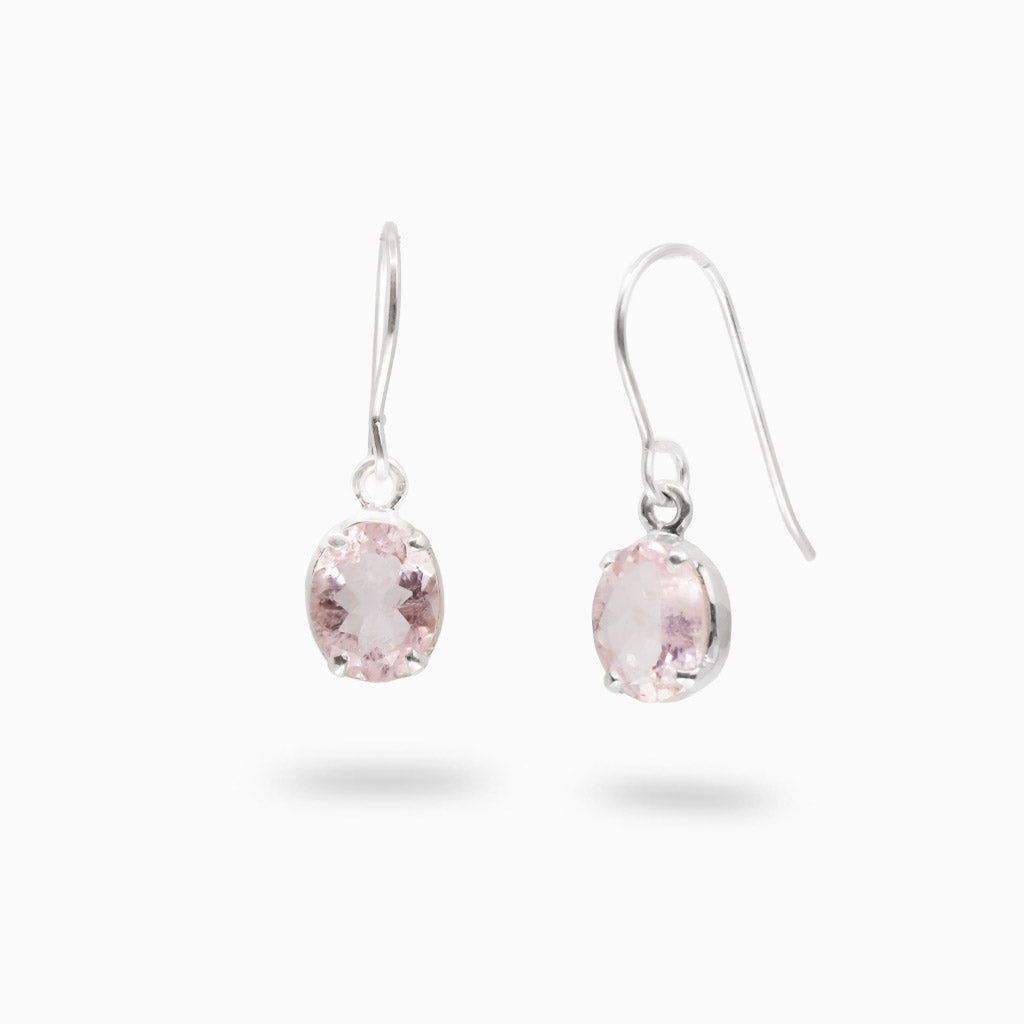 A pair of silver drop earrings with oval MORGANITE gemstones, shown against a plain white background.