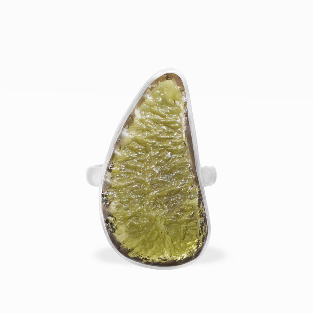 Freeform olive-green Moldavite ring with translucent textured tektite surface, polished sterling silver bezel setting, and smooth band.