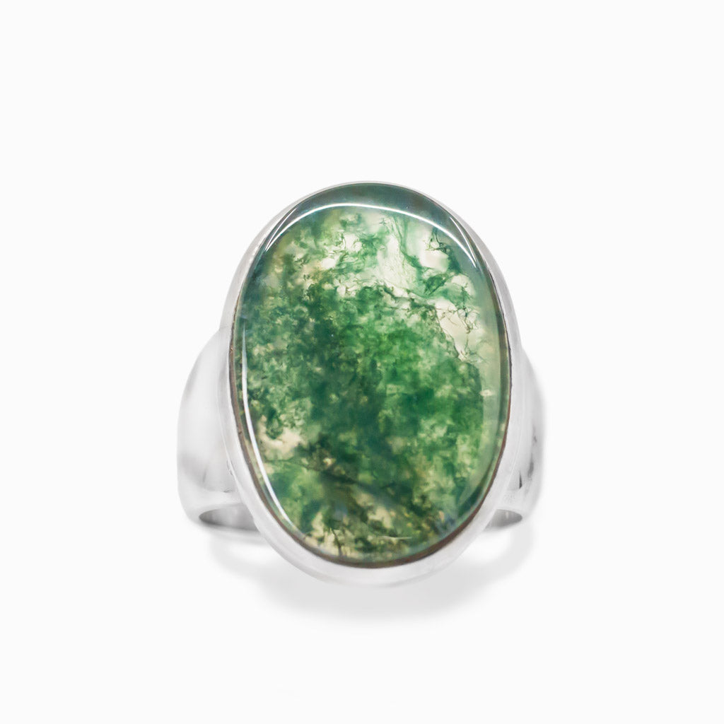 Oval Moss Agate cabochon sterling silver statement ring with natural green moss-like inclusions.