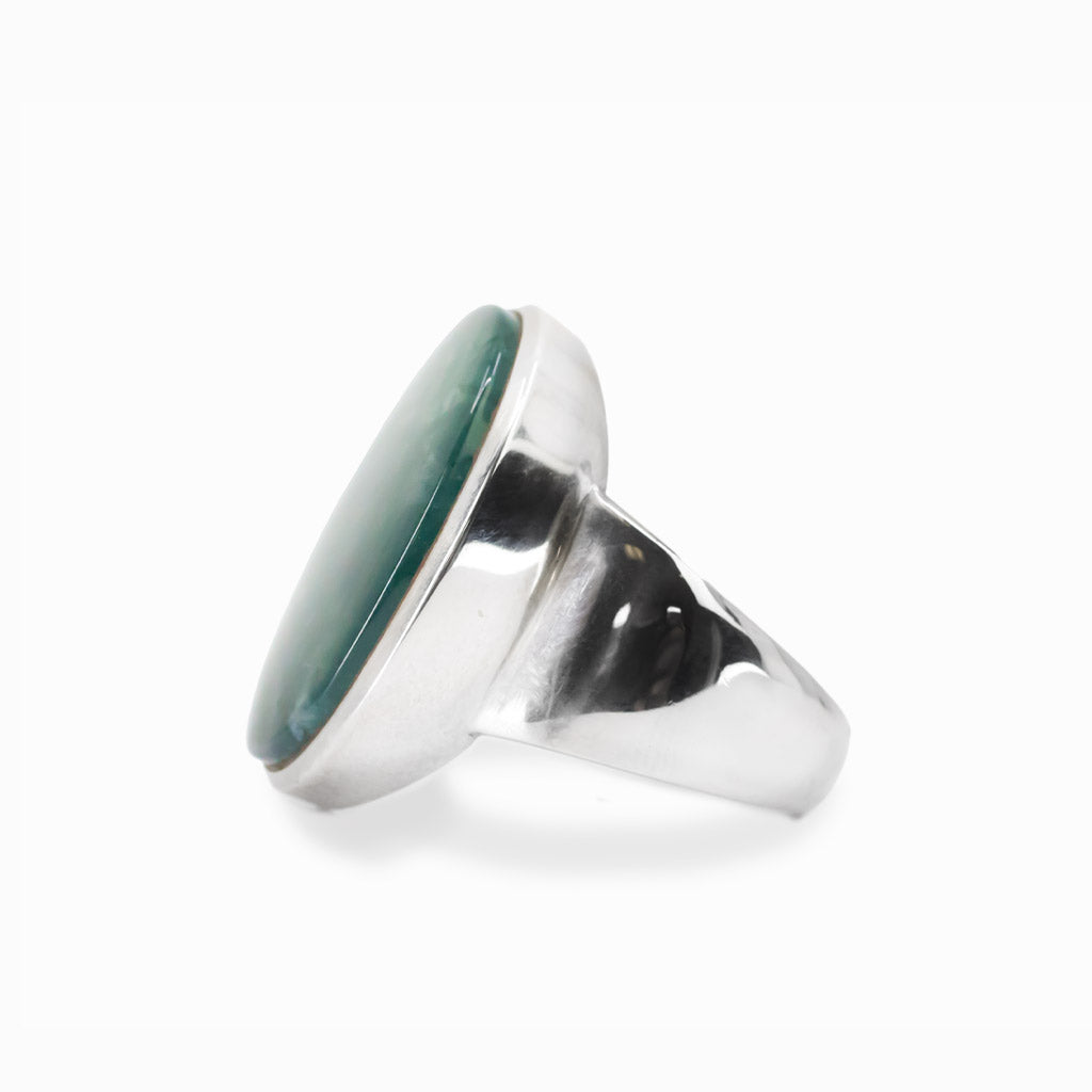 Oval Moss Agate cabochon sterling silver statement ring with natural green moss-like inclusions.