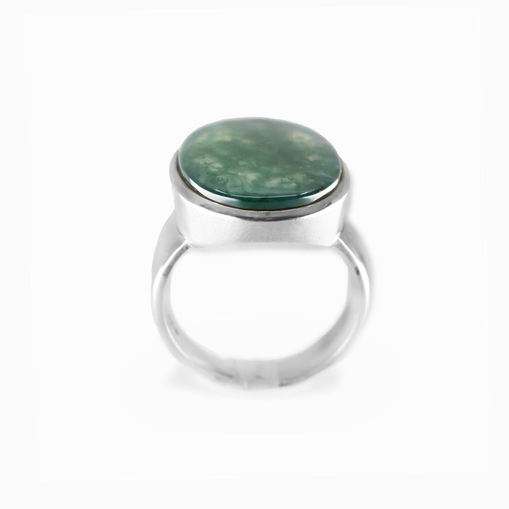 Oval Moss Agate cabochon sterling silver statement ring with natural green moss-like inclusions.