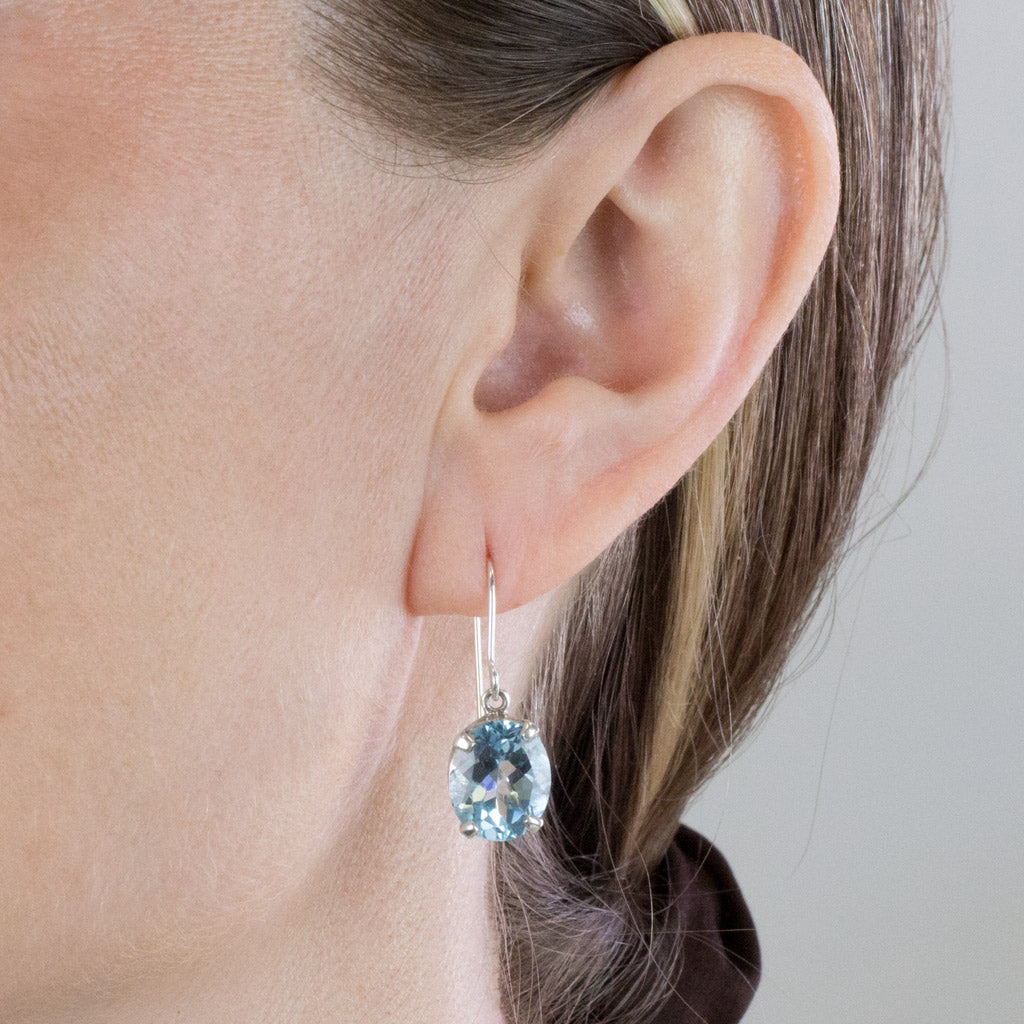 Blue topaz drop earrings on Model
