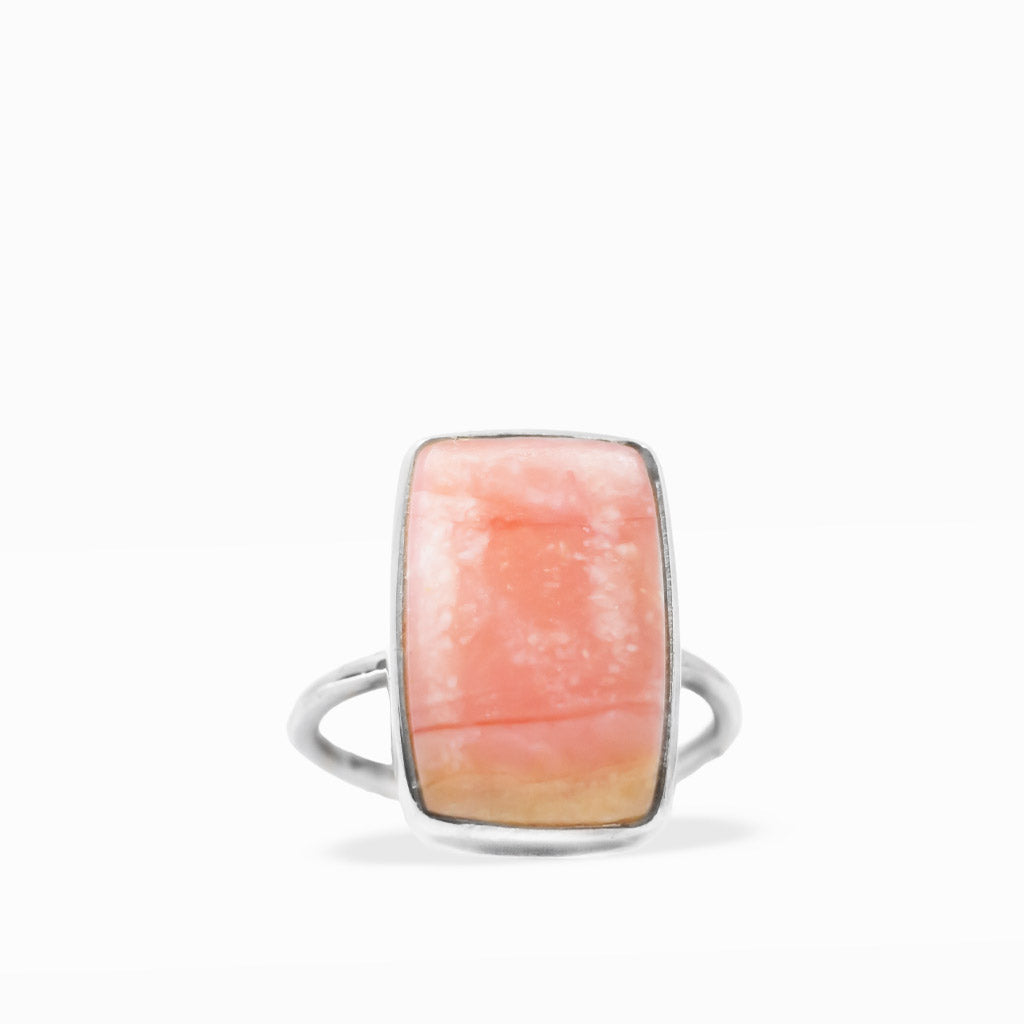 Rectangular peach-pink Opal cabochon ring with soft cream and golden tones, polished sterling silver bezel, and slim band.