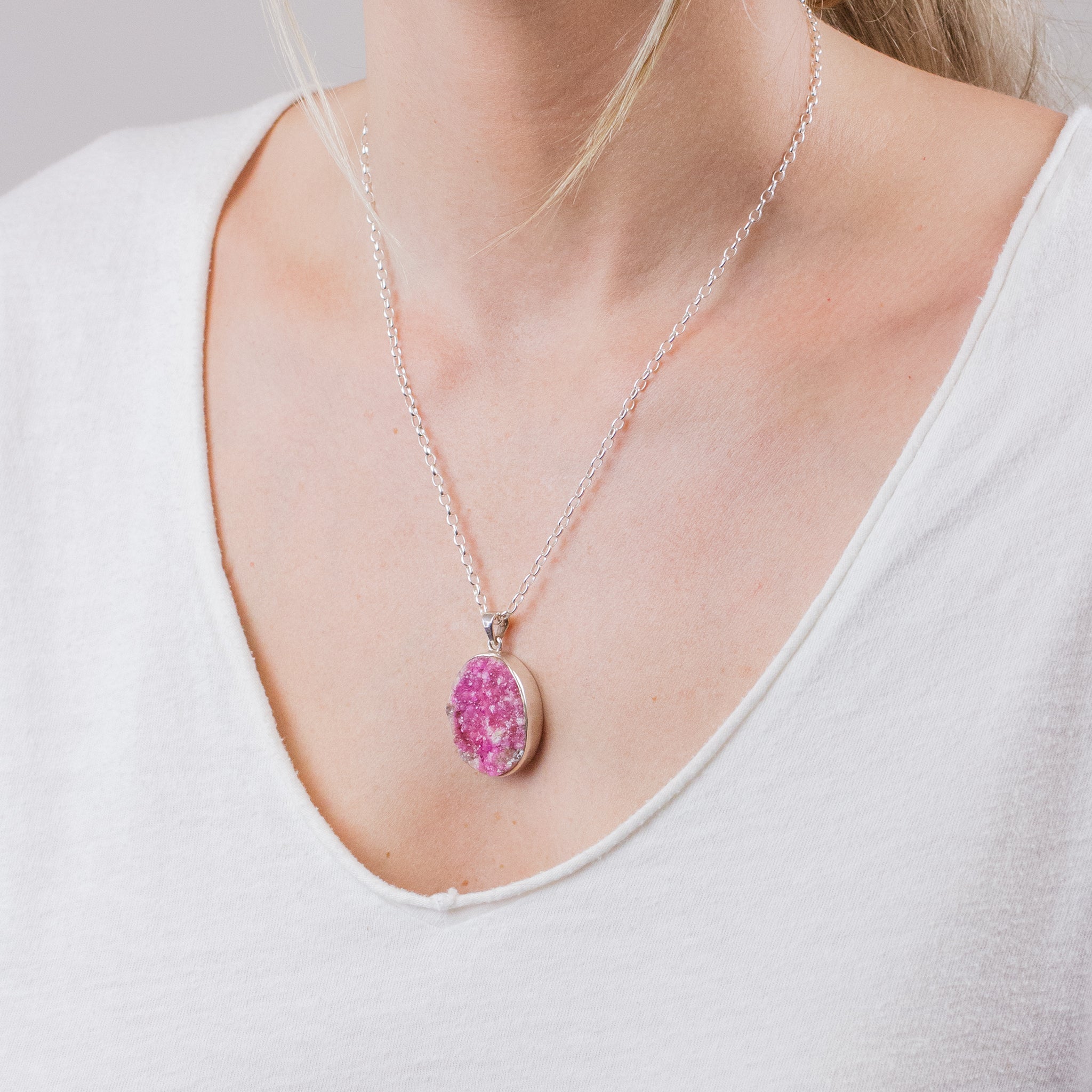 RAW OVAL PINK COBALTIAN CALCITE NECKLACE ON MODEL
