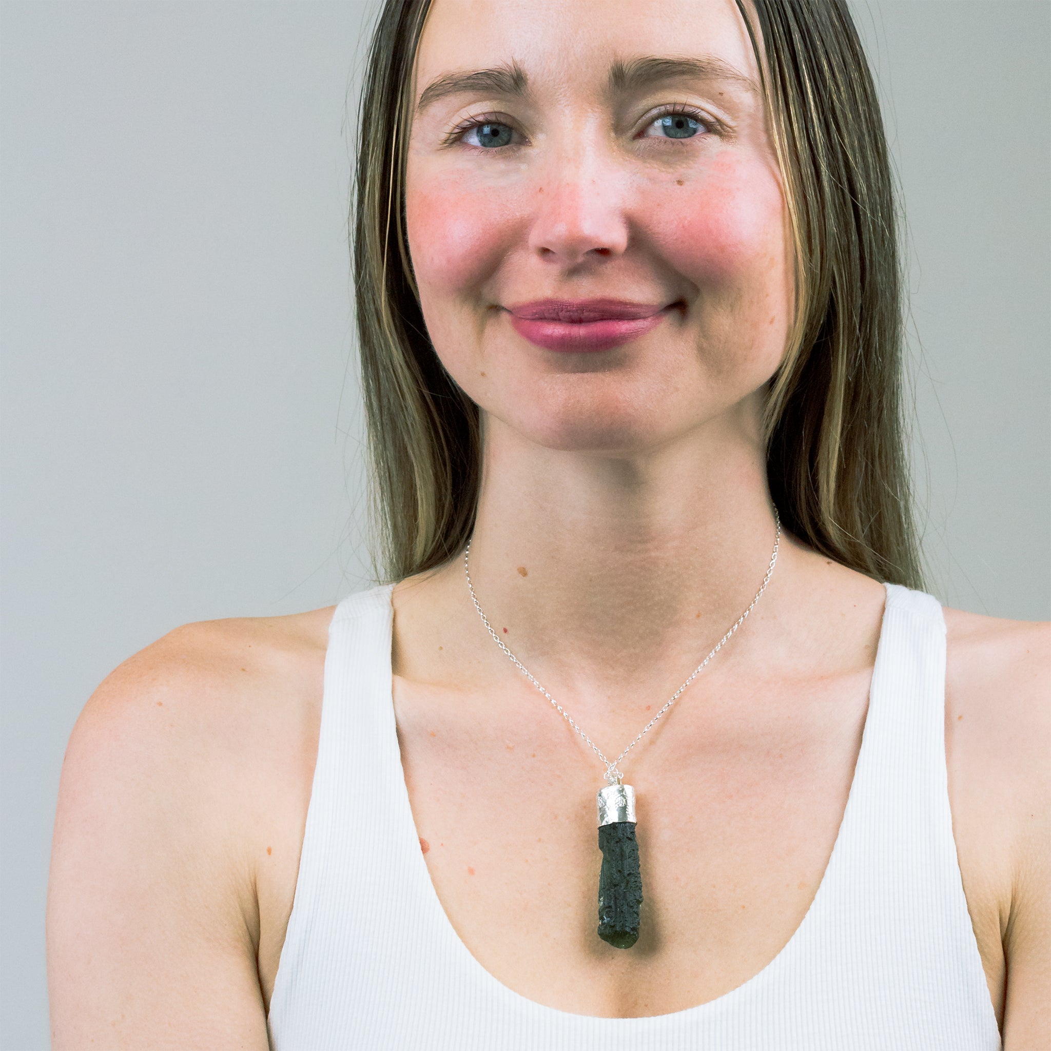 RAW MOLDAVITE NECKLACE ON MODEL