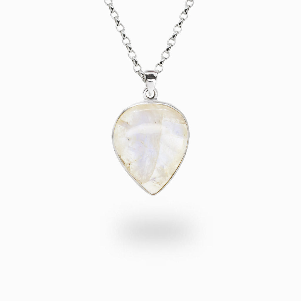 Pear-shaped Rainbow Moonstone pendant displaying natural blue flash, handcrafted in sterling silver with matching chain.