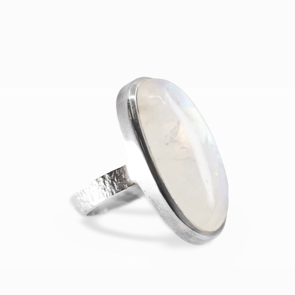 Oval Rainbow Moonstone cabochon sterling silver statement ring with blue iridescence.