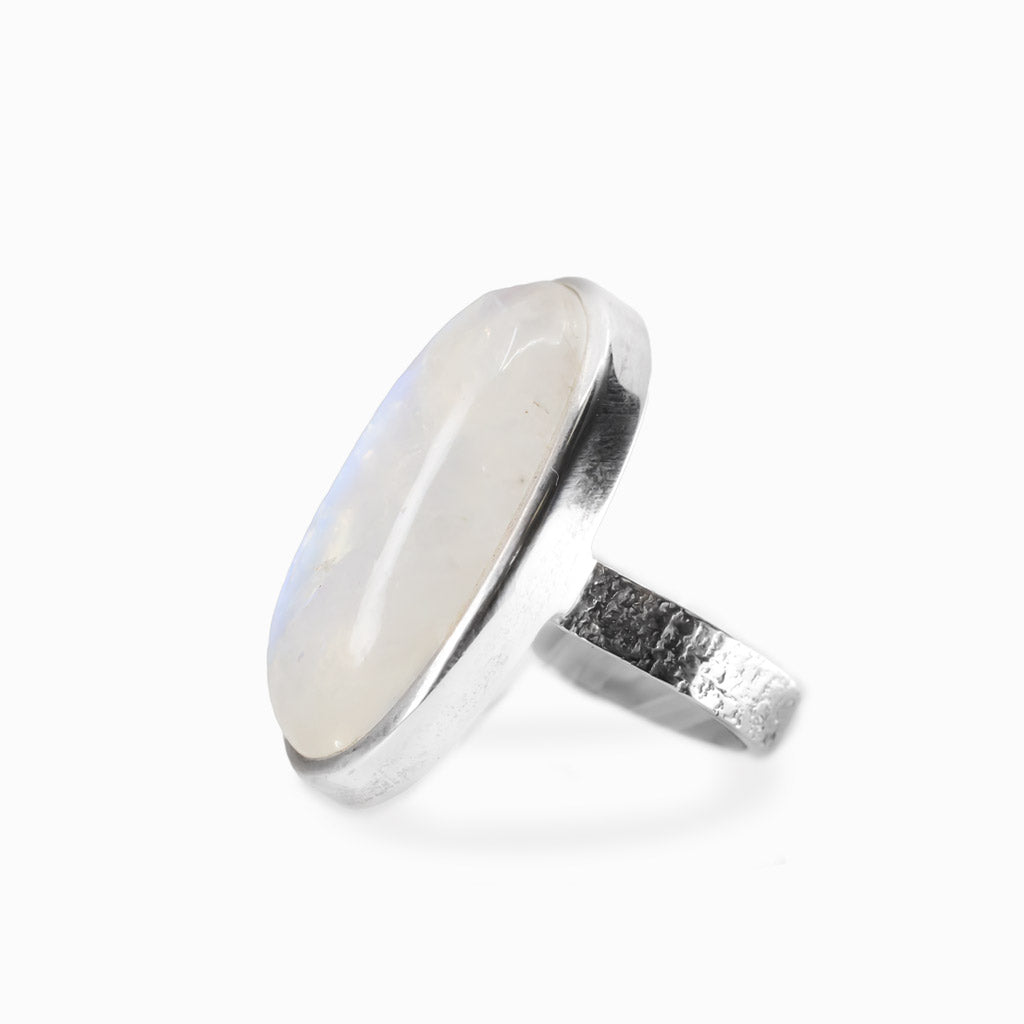 Oval Rainbow Moonstone cabochon sterling silver statement ring with blue iridescence.