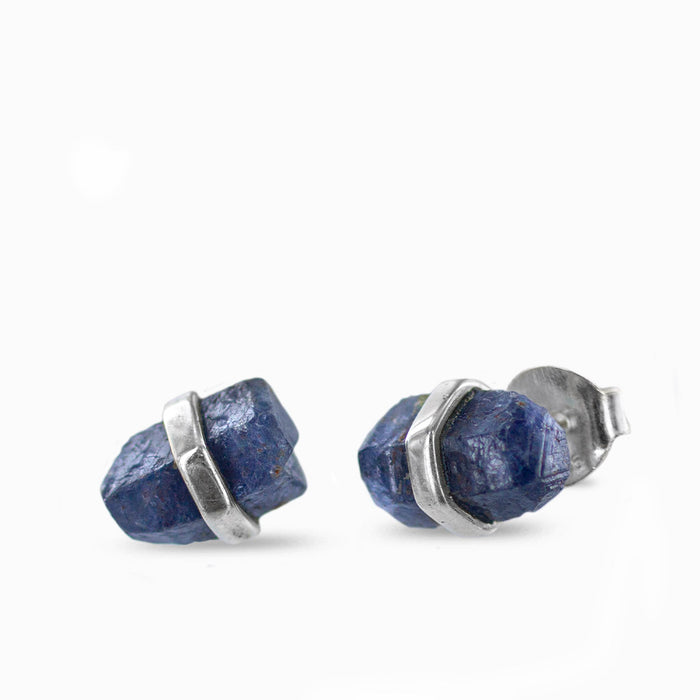 Raw blue Sapphire crystal stud earrings held in polished sterling silver settings.