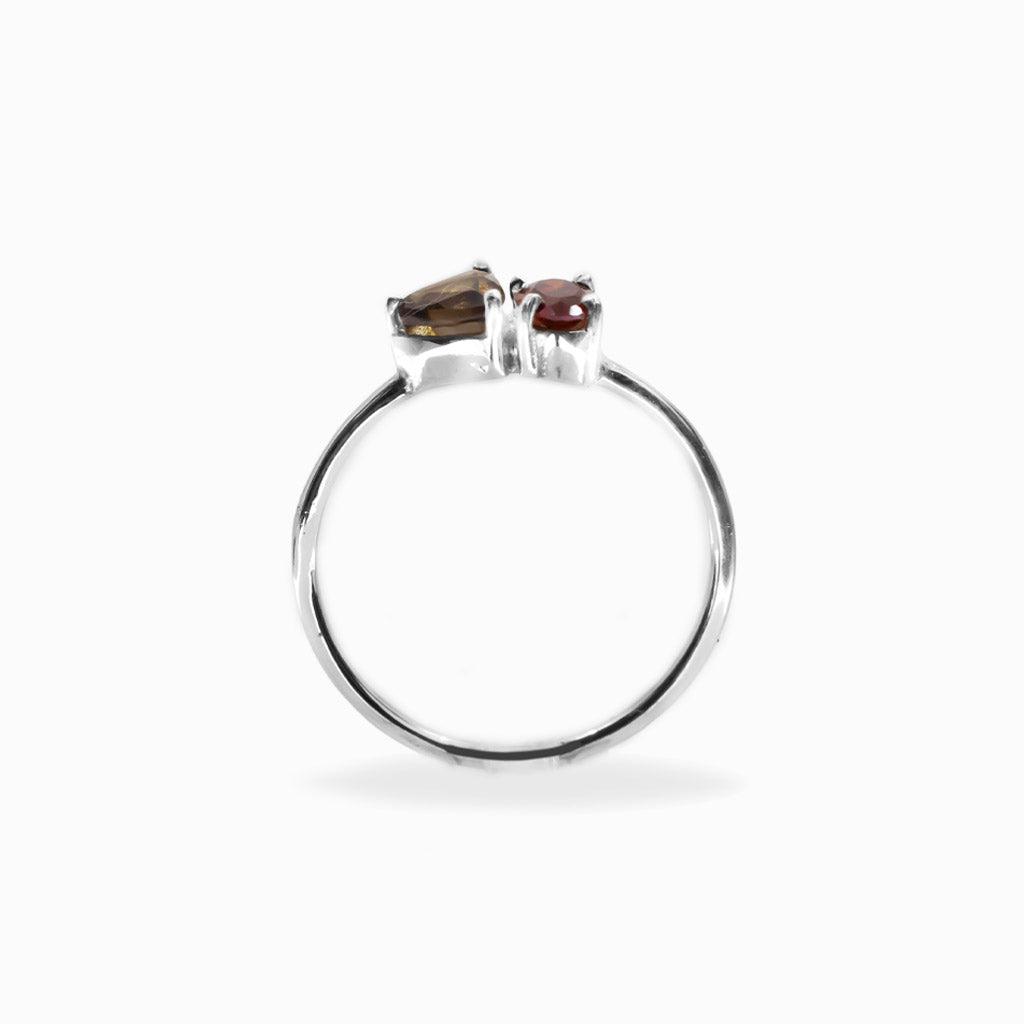 Faceted Garnet and pear-shaped Smoky Quartz two-stone ring in polished 925 sterling silver with a delicate silver band.