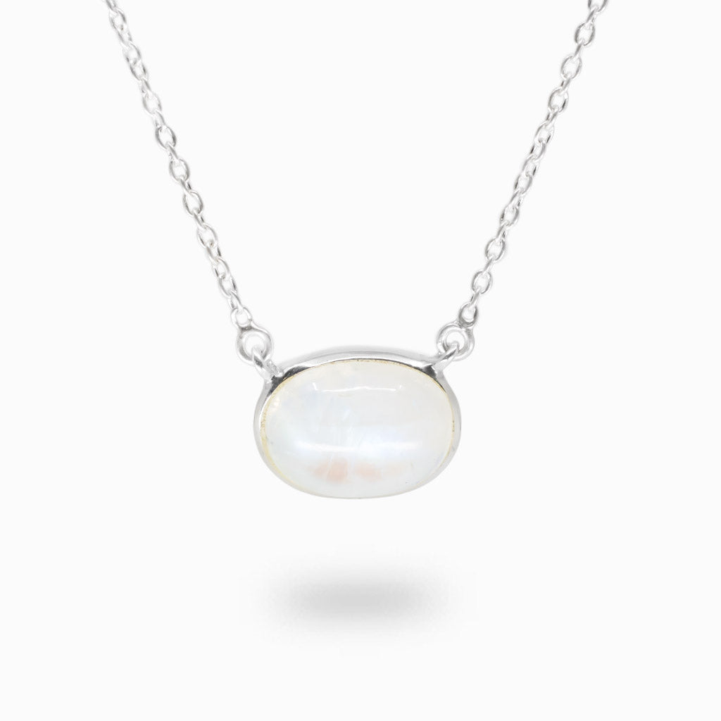 Rainbow Moonstone necklace in sterling silver featuring an oval cabochon with luminous blue iridescent flash.