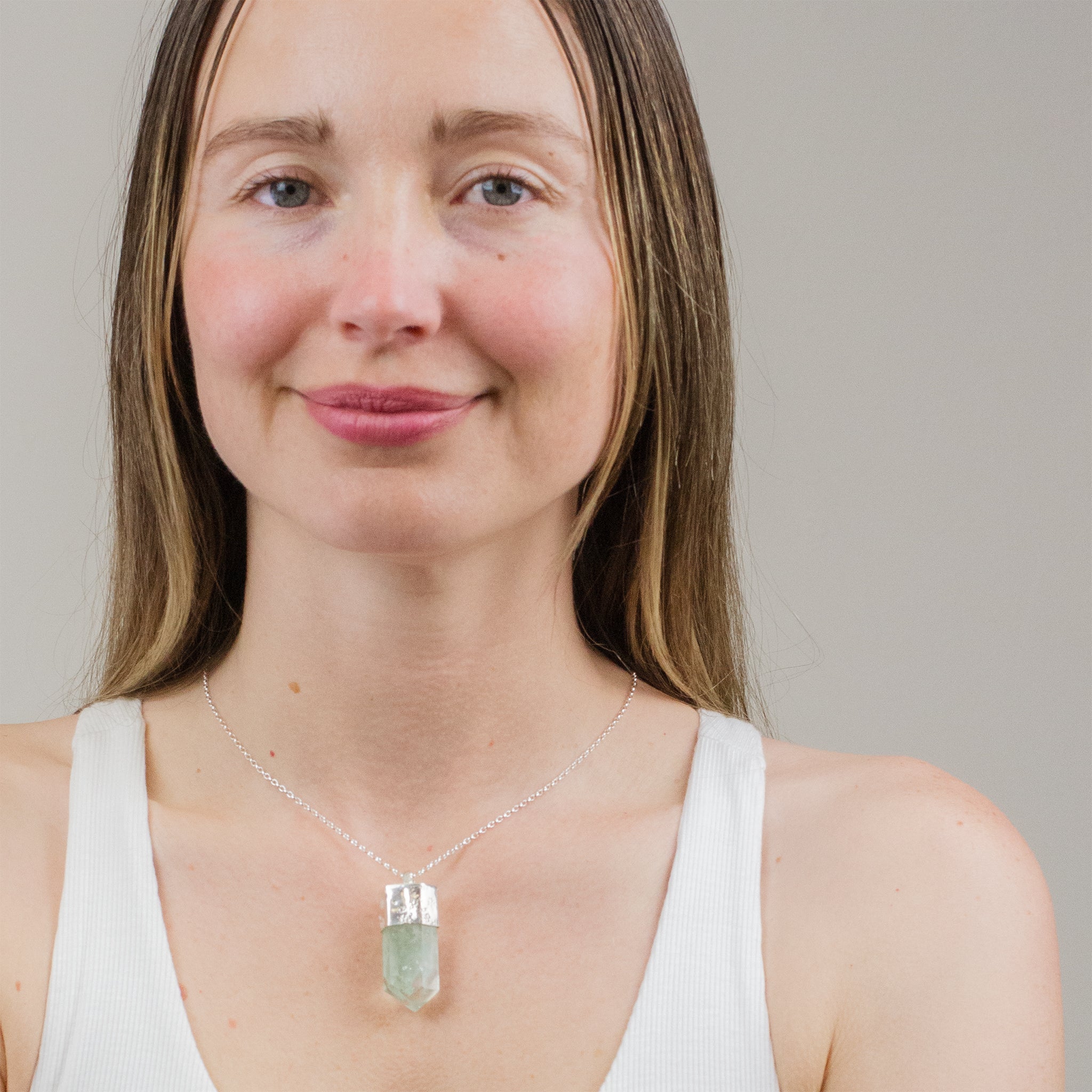 CELADONITE PHANTOM RAW POINT WITH TEXTURED CAP NECKLACE ON MODEL STERLING