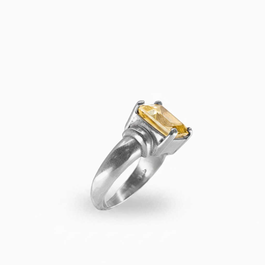 Rectangular faceted Citrine ring in polished 925 sterling silver with a warm golden-yellow gemstone and prong setting.