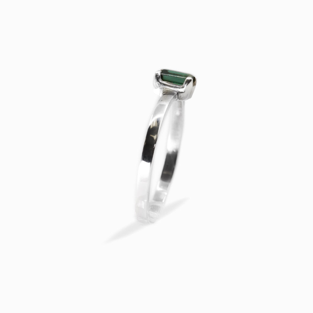 Elongated rectangular faceted Green Tourmaline ring in polished 925 sterling silver with a four-prong setting.