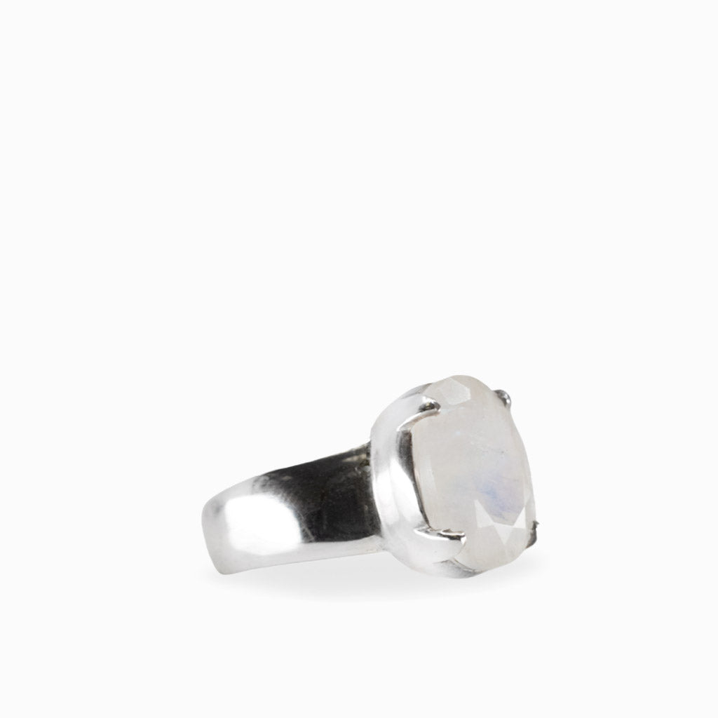 A sterling silver ring featuring a large, cushion-cut iridescent white gemstone in a prong setting, shown on a plain white background.