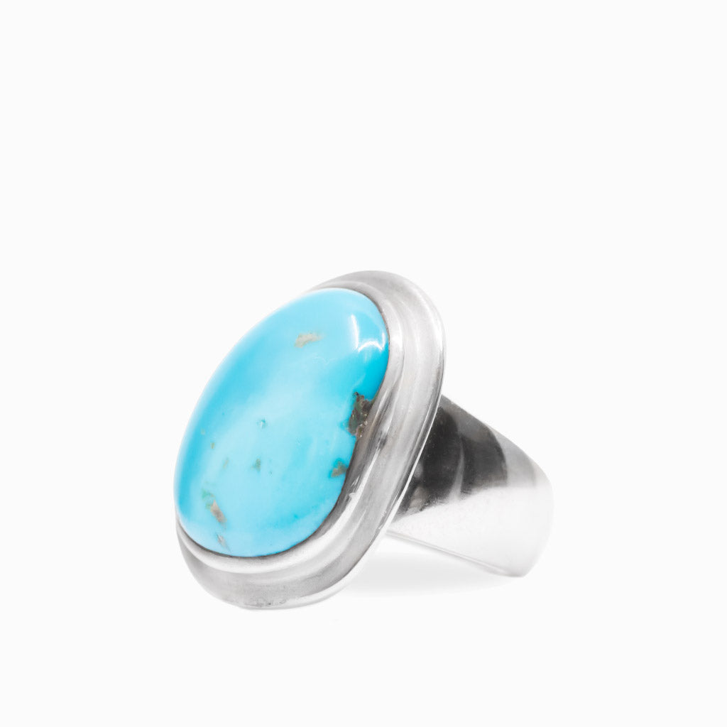 Bright blue Sleeping Beauty Turquoise cabochon ring set in a smooth polished 925 sterling silver bezel.