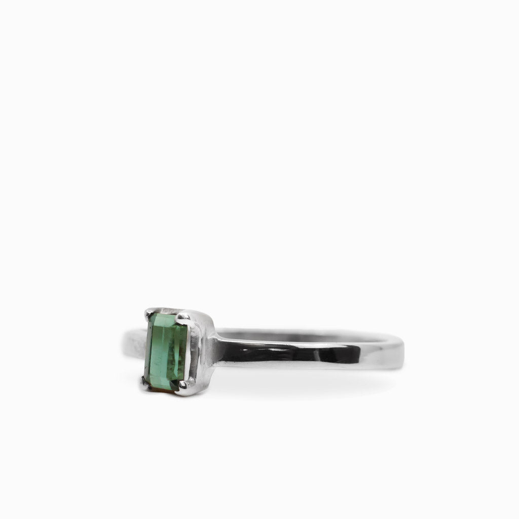 Elongated rectangular faceted Green Tourmaline ring in polished 925 sterling silver with a four-prong setting.