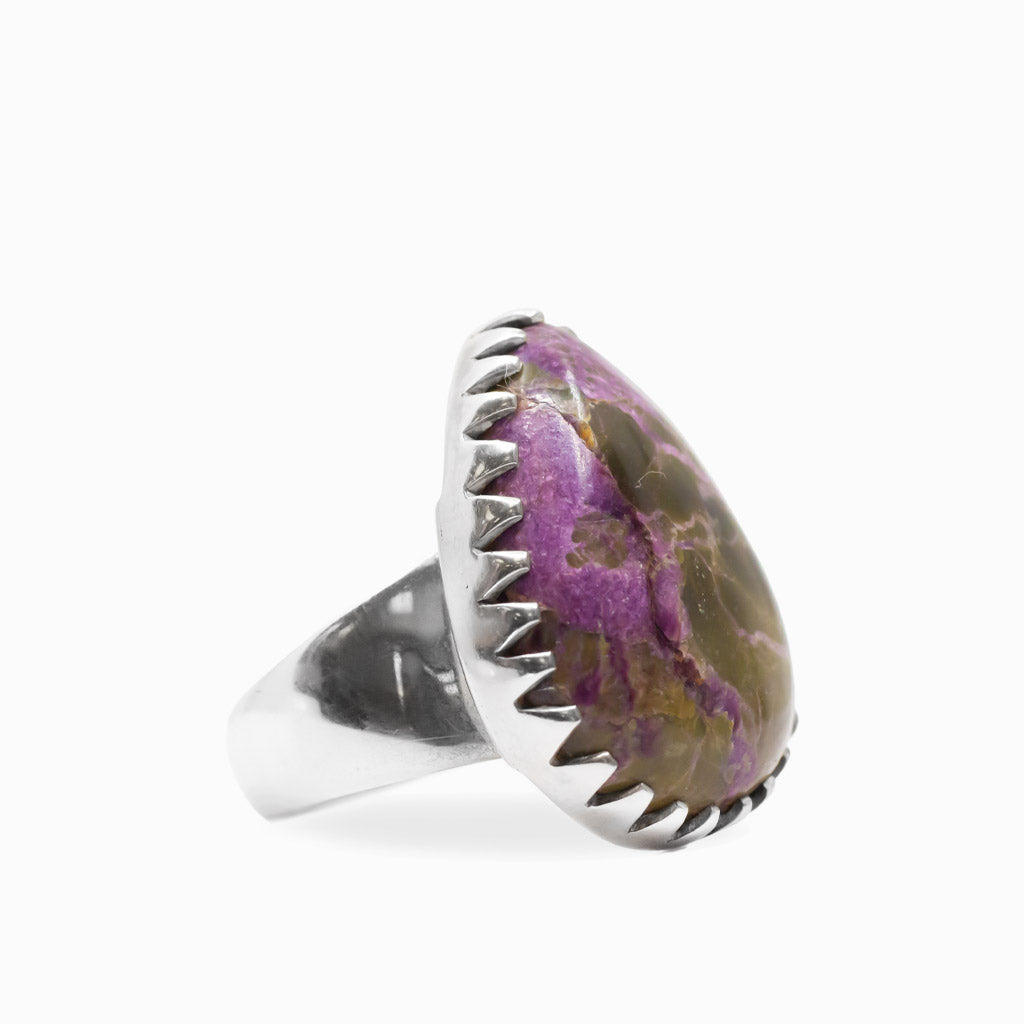 Purple and earthy brown Purpurite teardrop cabochon ring with decorative scalloped sterling silver setting.