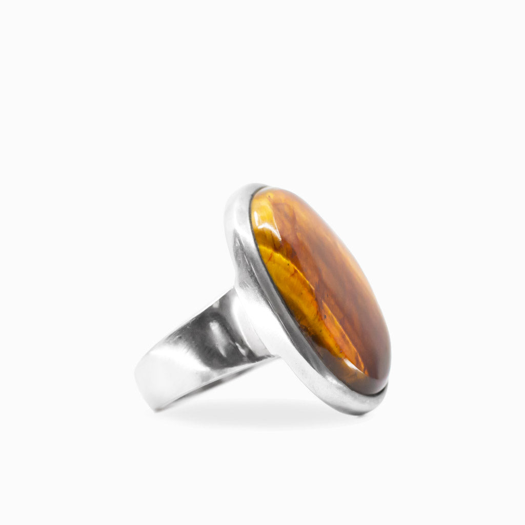 Golden-brown oval Tiger's Eye cabochon ring with natural chatoyancy set in polished 925 sterling silver.