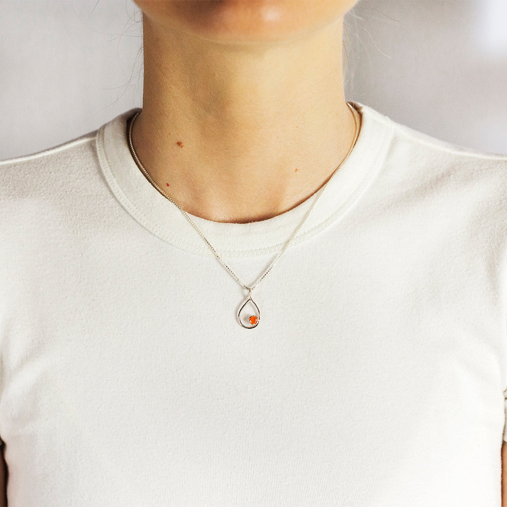 Orange Carnelian Birthstone set in Silver teardrop frame carnelian necklace made in earth On Model