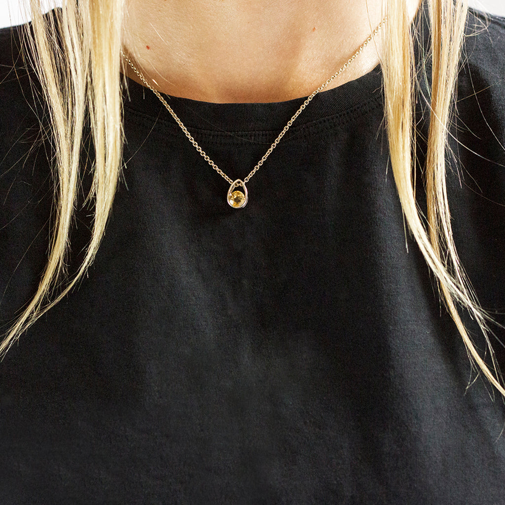 Yellow faceted circle Citrine Pendant set in silver teardrop frame citrine necklace made in earth On Model