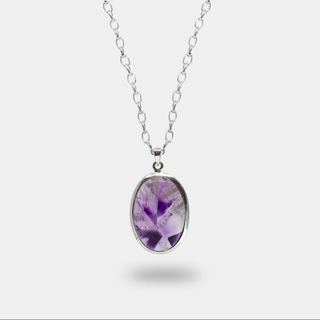 Oval auralite 23 cabochon pendant with purple inclusions in sterling silver necklace